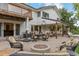 Backyard patio has a built-in fire pit and ample seating perfect for entertaining at 560 Front Range Rd, Littleton, CO 80120