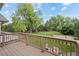The spacious backyard has a deck and patio area overlooking the lawn and a basketball court at 560 Front Range Rd, Littleton, CO 80120