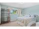 Comfortable bedroom filled with natural light and charming, decorative accents at 560 Front Range Rd, Littleton, CO 80120