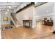 Spacious entryway featuring a staircase, hardwood floors, and an elegant console table at 560 Front Range Rd, Littleton, CO 80120