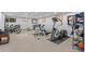 Home gym equipped with stationary bike, free weights, and other exercise equipment at 560 Front Range Rd, Littleton, CO 80120