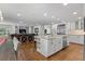 Modern kitchen with a large island, stainless steel appliances, and an open layout to the living area at 560 Front Range Rd, Littleton, CO 80120