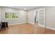 Open living room with gleaming wood floors and abundant natural light at 560 Front Range Rd, Littleton, CO 80120