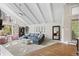 Bright living room featuring vaulted ceilings, large windows, and modern decor creating a welcoming atmosphere at 560 Front Range Rd, Littleton, CO 80120