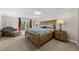 Comfortable main bedroom boasts a walkout to the deck, plush chair, and natural lighting at 560 Front Range Rd, Littleton, CO 80120