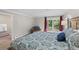 This lovely primary bedroom offers deck access, calm earth tones, and ample natural light at 560 Front Range Rd, Littleton, CO 80120