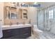 Modern bathroom with double vanity and walk-in shower at 4508 E Louisiana Ave, Denver, CO 80246