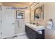 Elegant bathroom with double vanity and large mirror at 4508 E Louisiana Ave, Denver, CO 80246