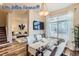 Modern dining room with hardwood floors and a view of living room at 4508 E Louisiana Ave, Denver, CO 80246