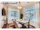 Bright dining room featuring hardwood floors and large windows at 4508 E Louisiana Ave, Denver, CO 80246