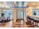 Bright dining room with hardwood floors and view into kitchen at 4508 E Louisiana Ave, Denver, CO 80246