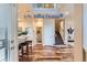 Light and bright entryway with hardwood floors and staircase at 4508 E Louisiana Ave, Denver, CO 80246