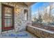 Front porch with stone facade and security door at 4508 E Louisiana Ave, Denver, CO 80246