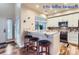 Modern kitchen with white cabinets, granite counters, and stainless steel appliances at 4508 E Louisiana Ave, Denver, CO 80246