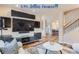 Spacious living room with a large TV and hardwood floors at 4508 E Louisiana Ave, Denver, CO 80246