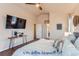 Main bedroom with a king-size bed and large TV at 4508 E Louisiana Ave, Denver, CO 80246