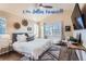 Spacious main bedroom with a king-size bed and ceiling fan at 4508 E Louisiana Ave, Denver, CO 80246