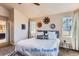 Bright main bedroom with a king bed and ensuite bathroom at 4508 E Louisiana Ave, Denver, CO 80246