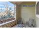 Small patio with two metal chairs and a small round table at 4508 E Louisiana Ave, Denver, CO 80246