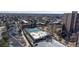 Aerial view of the building complex featuring a park and tennis courts at 7865 E Mississippi Ave # 702, Denver, CO 80247