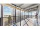Spacious balcony with floor-to-ceiling windows offering city views and ample natural light at 7865 E Mississippi Ave # 702, Denver, CO 80247