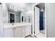 Well-lit bathroom with modern fixtures and a vanity featuring ample storage at 7865 E Mississippi Ave # 702, Denver, CO 80247