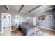 This bedroom features exposed beams and an ensuite bathroom at 7865 E Mississippi Ave # 702, Denver, CO 80247