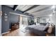 This bedroom features exposed beams and balcony with beautiful views at 7865 E Mississippi Ave # 702, Denver, CO 80247