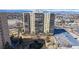Modern apartment building with large windows and a meticulously landscaped courtyard and fountain at 7865 E Mississippi Ave # 702, Denver, CO 80247