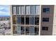 Exterior view showcasing large windows and private balconies at 7865 E Mississippi Ave # 702, Denver, CO 80247