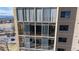 Exterior view showcasing large windows and private balconies at 7865 E Mississippi Ave # 702, Denver, CO 80247