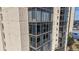 Exterior view showcasing large windows and private balconies at 7865 E Mississippi Ave # 702, Denver, CO 80247