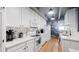 Bright and airy kitchen showcasing the cabinetry, countertops and stainless steel appliances at 7865 E Mississippi Ave # 702, Denver, CO 80247