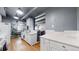 Well-lit kitchen featuring a white cabinets, quartz countertops and stainless steel appliances at 7865 E Mississippi Ave # 702, Denver, CO 80247