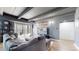 Inviting living room with a large sectional sofa, modern decor, and access to a balcony at 7865 E Mississippi Ave # 702, Denver, CO 80247