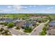 An aerial view of a residential neighborhood with manicured lawns, mature trees and convenient street parking at 5021 S Rome St, Aurora, CO 80015
