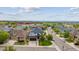 Aerial view of a well-maintained home in a suburban neighborhood with mature trees and landscaping at 5021 S Rome St, Aurora, CO 80015