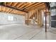 Unfinished basement with exposed ceiling and beams, ready for customization to create a dream living space at 5021 S Rome St, Aurora, CO 80015