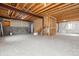 Large unfinished basement featuring carpeting, utilities, and exposed ceiling awaiting your personal touch at 5021 S Rome St, Aurora, CO 80015