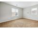 Bedroom with natural light, neutral walls, and neutral carpet at 5021 S Rome St, Aurora, CO 80015