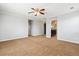 An empty bedroom with neutral paint, a ceiling fan, and bright, natural light at 5021 S Rome St, Aurora, CO 80015