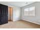 Bedroom featuring a closet and window for natural light at 5021 S Rome St, Aurora, CO 80015