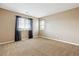Neutral bedroom with plush carpet and plenty of natural light at 5021 S Rome St, Aurora, CO 80015