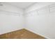 Walk-in closet featuring wire shelving and neutral carpeting at 5021 S Rome St, Aurora, CO 80015