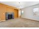 Bright living room with modern fireplace and neutral tones at 5021 S Rome St, Aurora, CO 80015