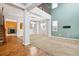 Open-concept living space with tall ceilings, carpet, fireplace, and natural light at 5021 S Rome St, Aurora, CO 80015