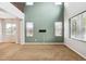 Spacious living room boasts high ceilings, large windows, and neutral tones at 5021 S Rome St, Aurora, CO 80015