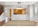 Open-concept living room with hardwood floors and modern chandelier at 5021 S Rome St, Aurora, CO 80015
