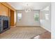 Inviting living room with a cozy fireplace and stylish light fixture at 5021 S Rome St, Aurora, CO 80015