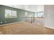 Spacious loft area with large windows and natural light, perfect for a home office or playroom at 5021 S Rome St, Aurora, CO 80015